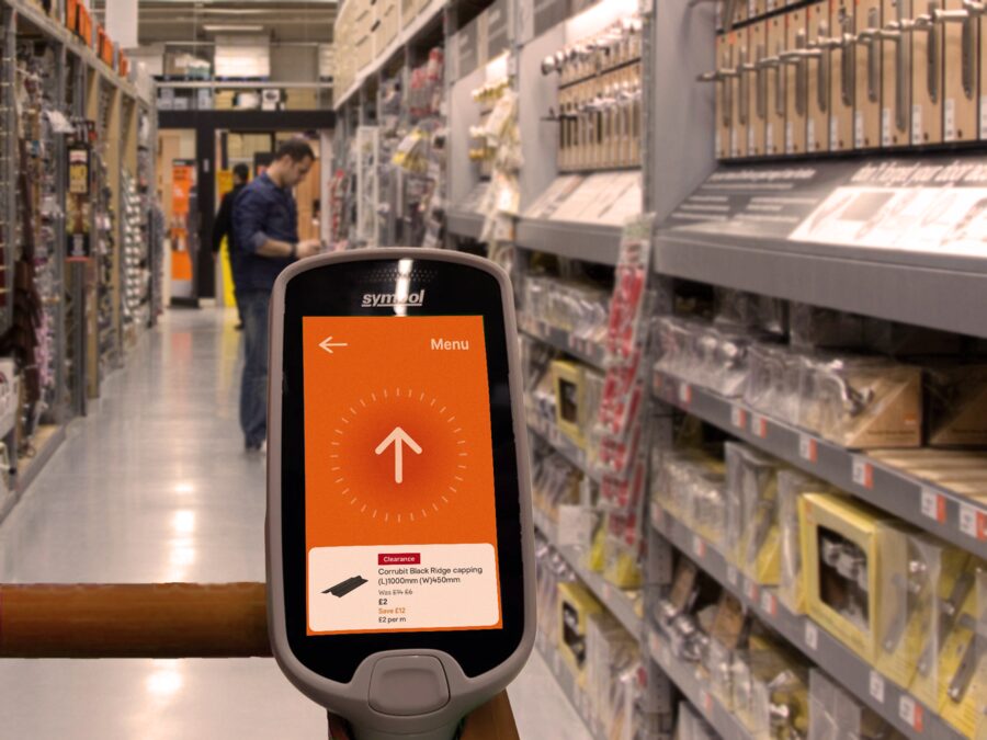Handheld scanner in a DIY store aisle