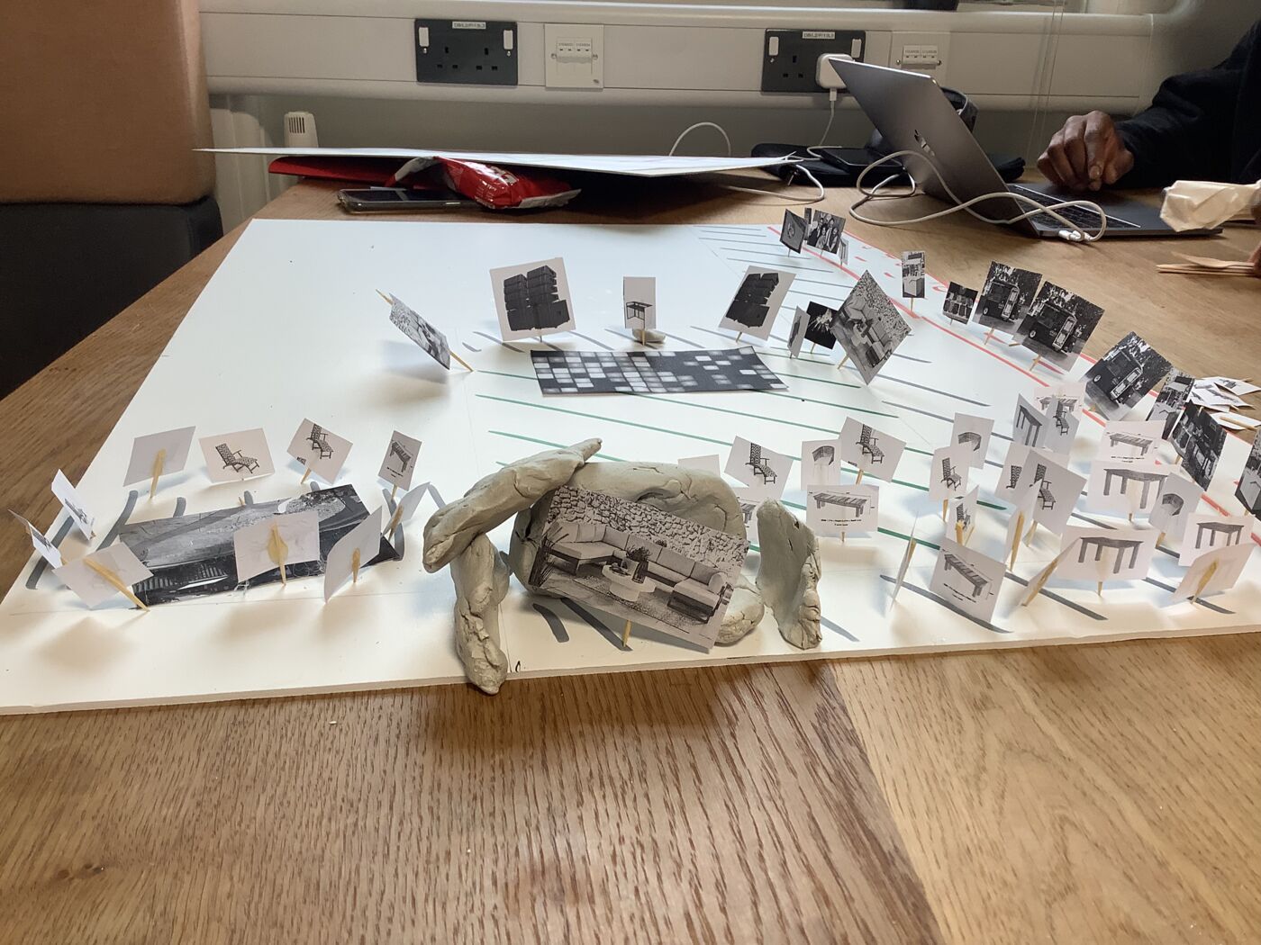 Physical map with paper cut-outs and pawns