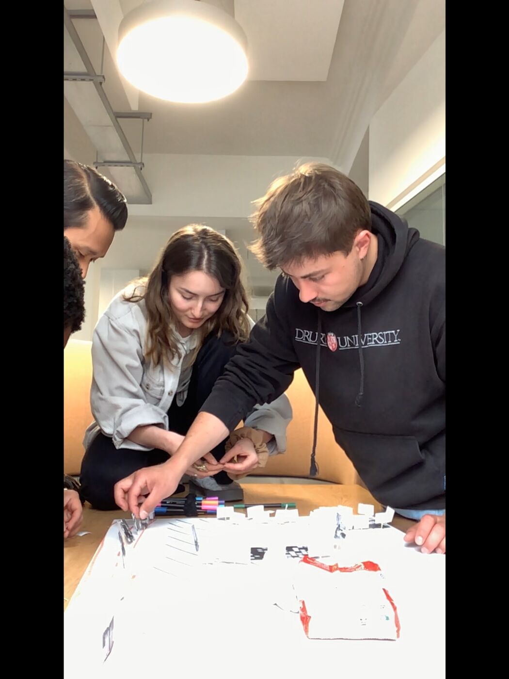 Participants building a map together on a table