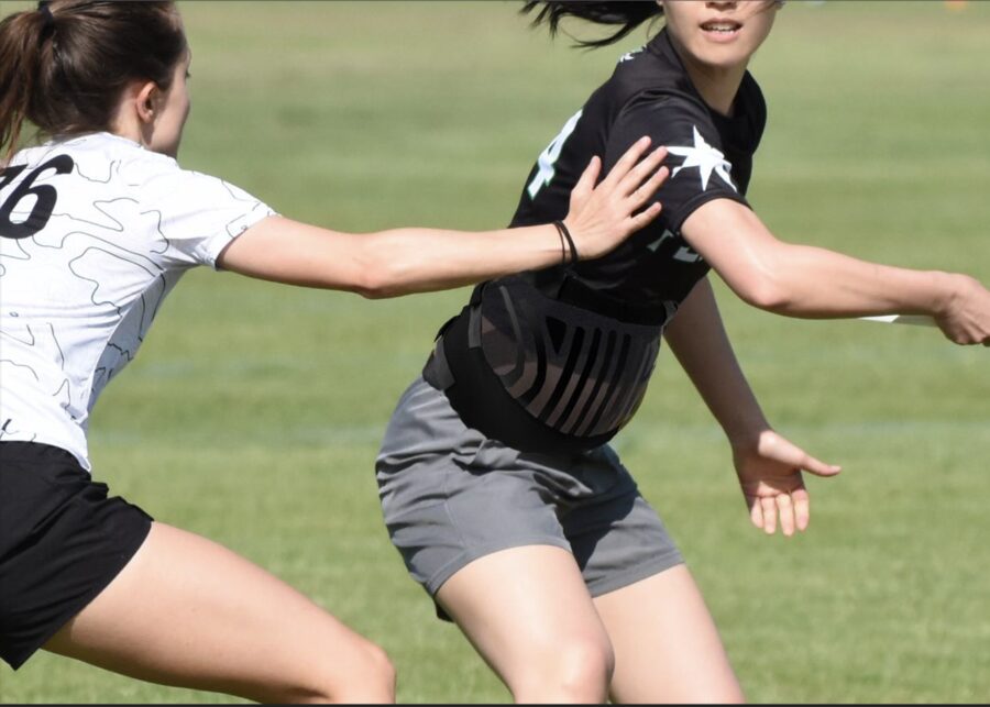 Athlete wearing a performance pregnancy band